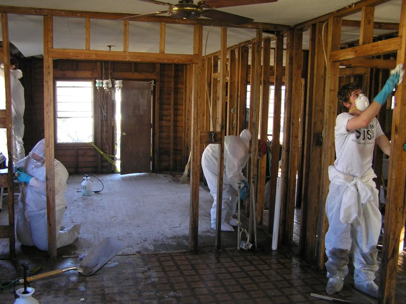 Remediation workers wearing PPE during cleanup